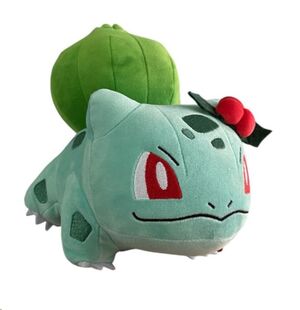 POKÉMON PELUCHE BULBASAUR CON MUERDAGO ROJO 20 CM