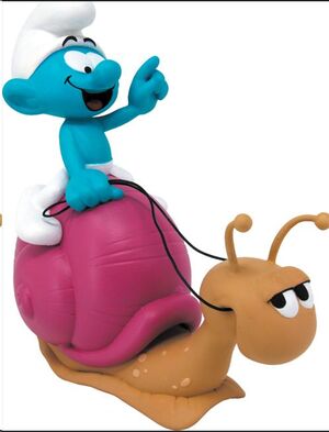 LOS PITUFOS - PITUFO EN CARACOL HUCHA 19CM