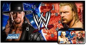 WWE RELOJ DESPERTADOR UNDERTAKER VS TRIPLE H MODELO A                      