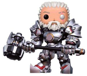 OVERWATCH FIGURA 15 CM REINHARDT UNMASKED VINYL POP                        